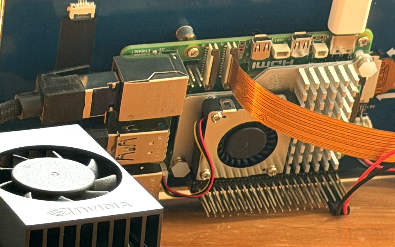 Close-up of the NVIDIA-branded edge computer beside its board, the NVIDIA wordmark legible